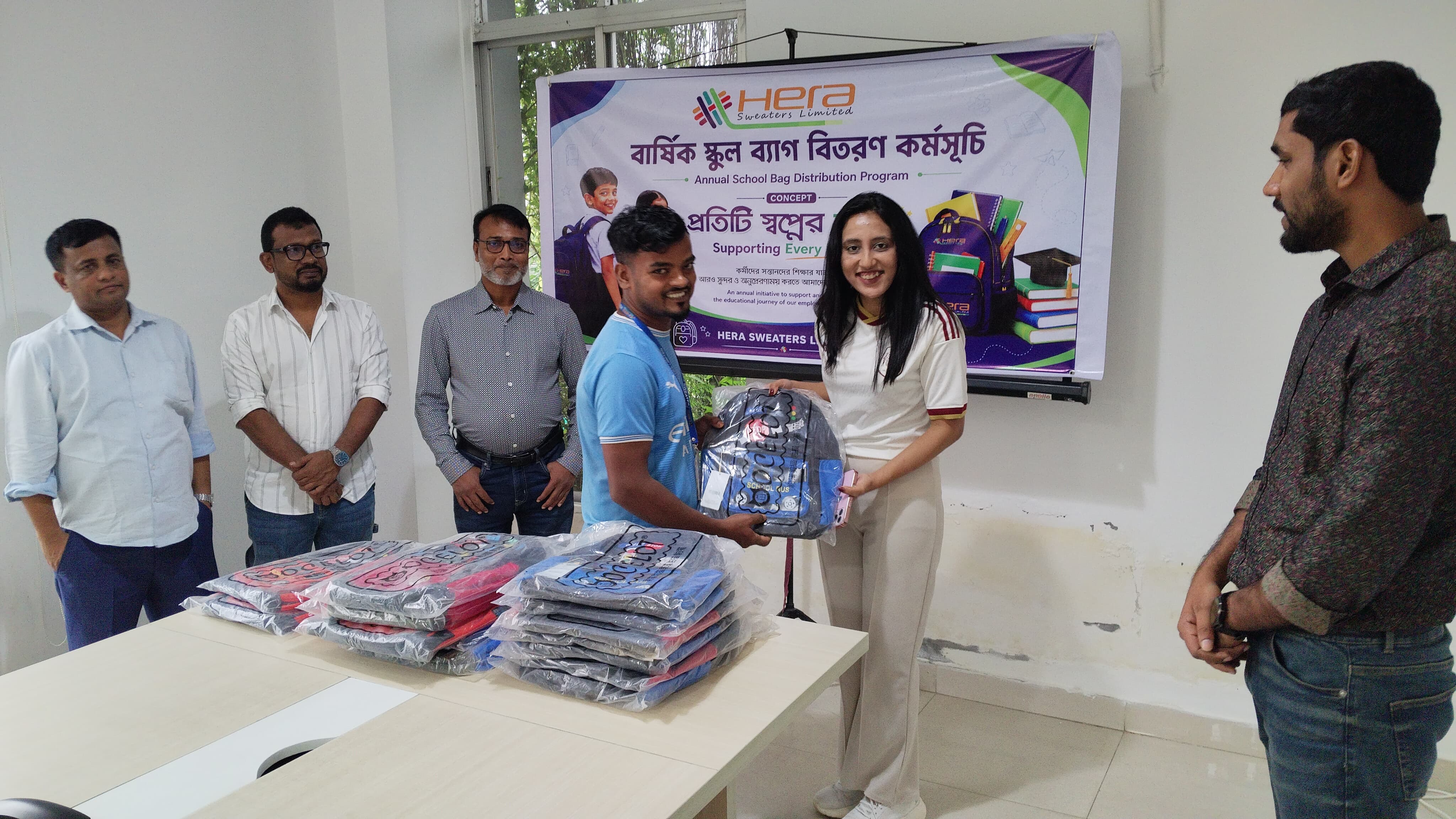 Carrying Hope to School: Hera Sweaters Gifts School Bags to Workers' Children